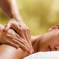 Therapist giving a shoulder massage to a guest in the spa at Oregon Garden Resort, a top choice hotel in Silverton