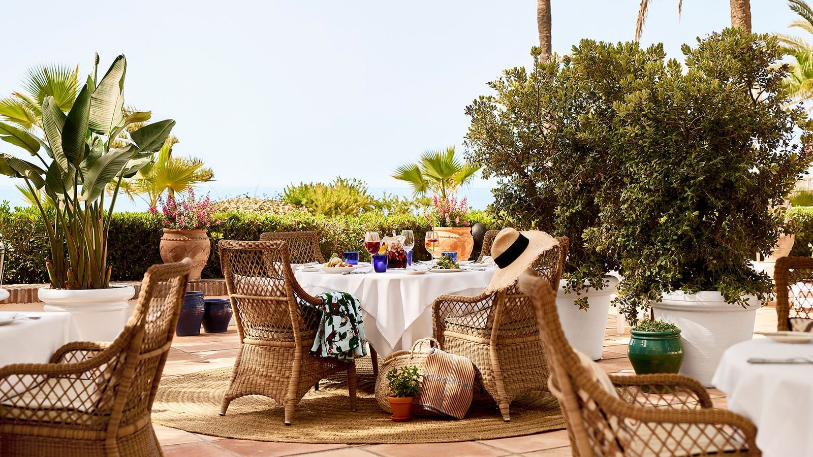 Outdoor dining table set up in Beach Club at Marbella Club