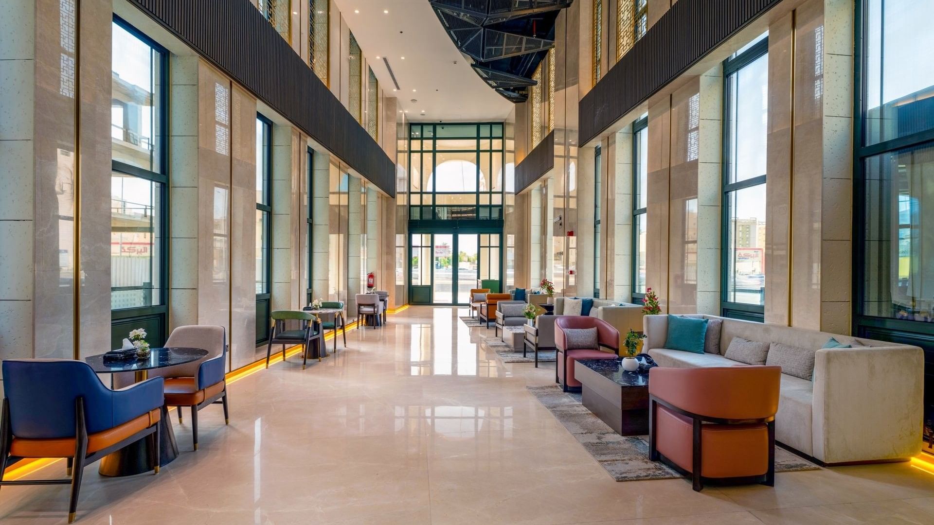Armchairs and ceiling windows in Lobby Café at Naviti by Warwick, showcasing elegant dining at a Boutique Hotel in Jeddah