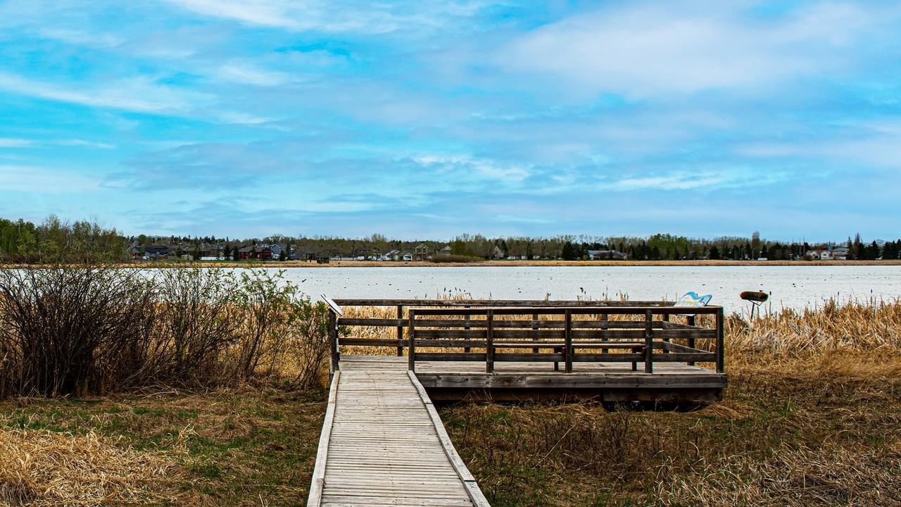 Wooden boardwalk leading to a wooden deck.