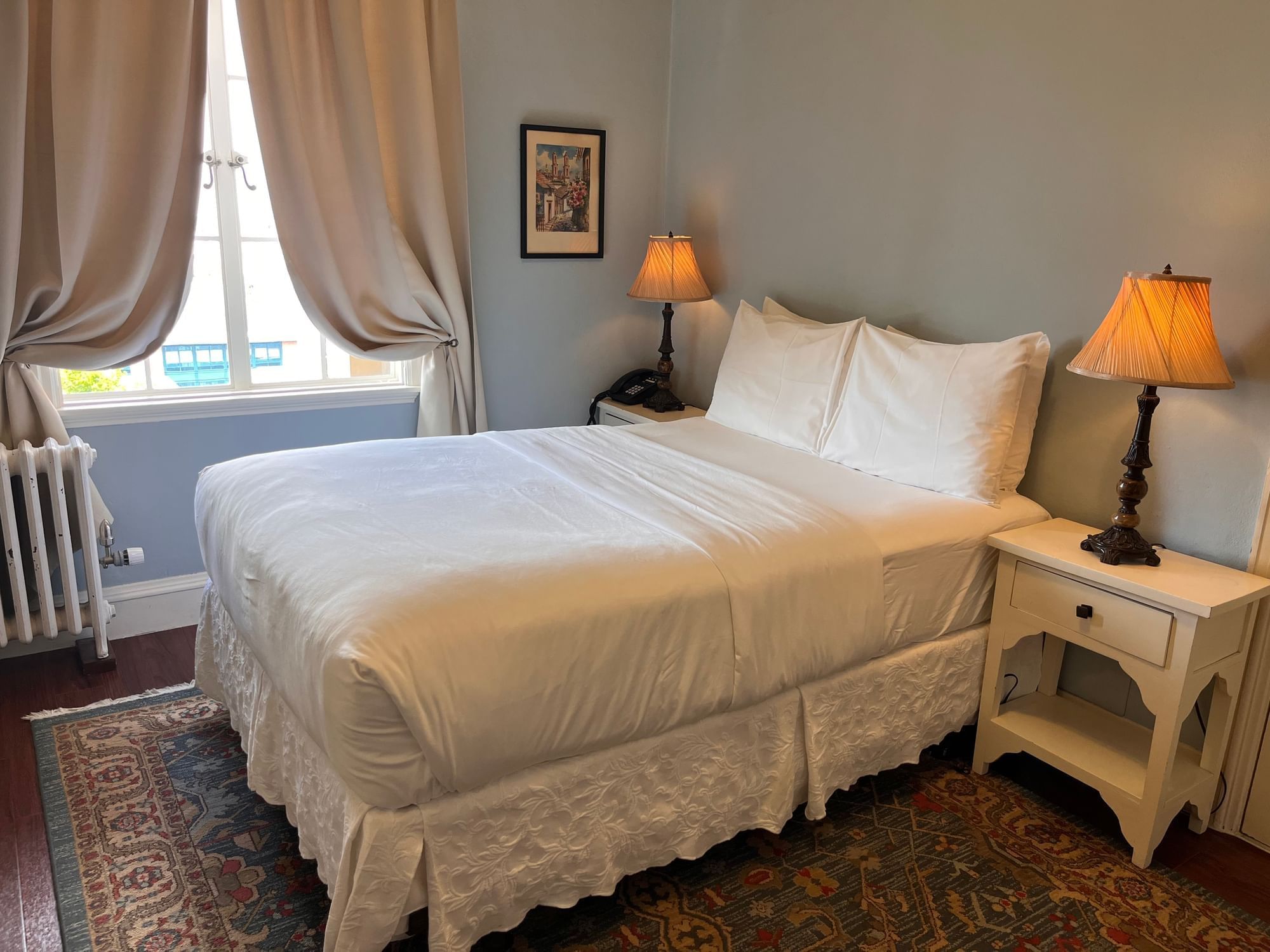 Interior of Standard Full City View room with classic furniture at Berkeley City Club