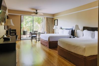 Two large beds in Patio Room at Dinah's Garden Hotel