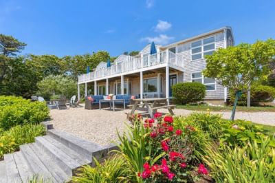 The front garden of Hightide Oceanview Three Bedroom Suite  with arranged seating area at Chatham Tides Resort