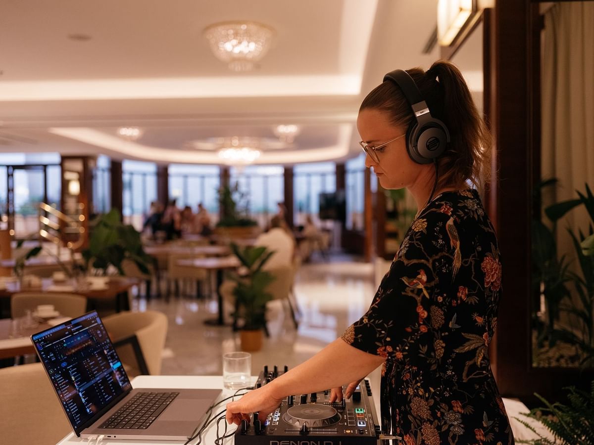 DJ artist by the booth in the Restaurant at Almanac X Alcron Prague