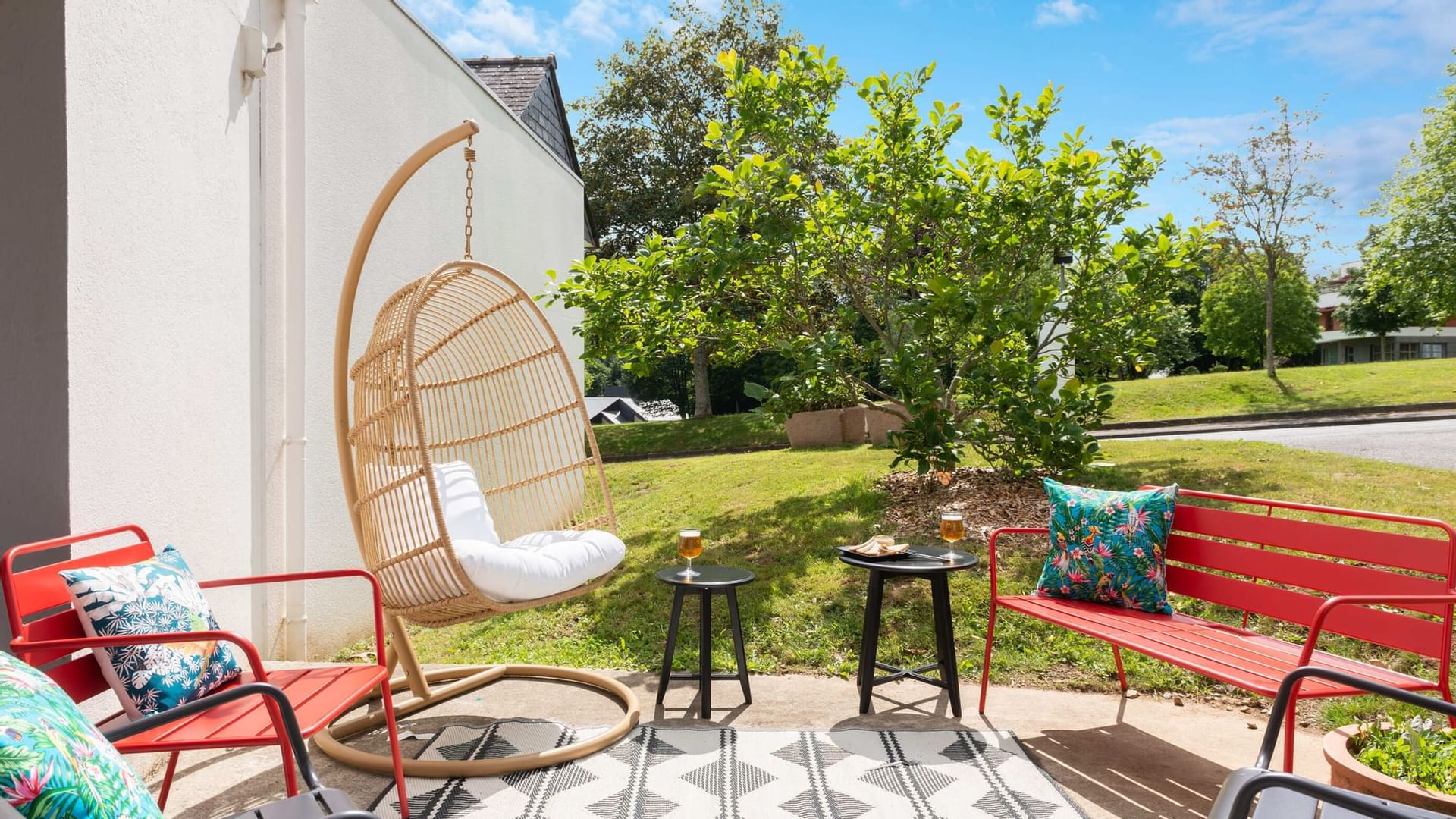 Various types of chairs in the gardens at The Originals Hotels