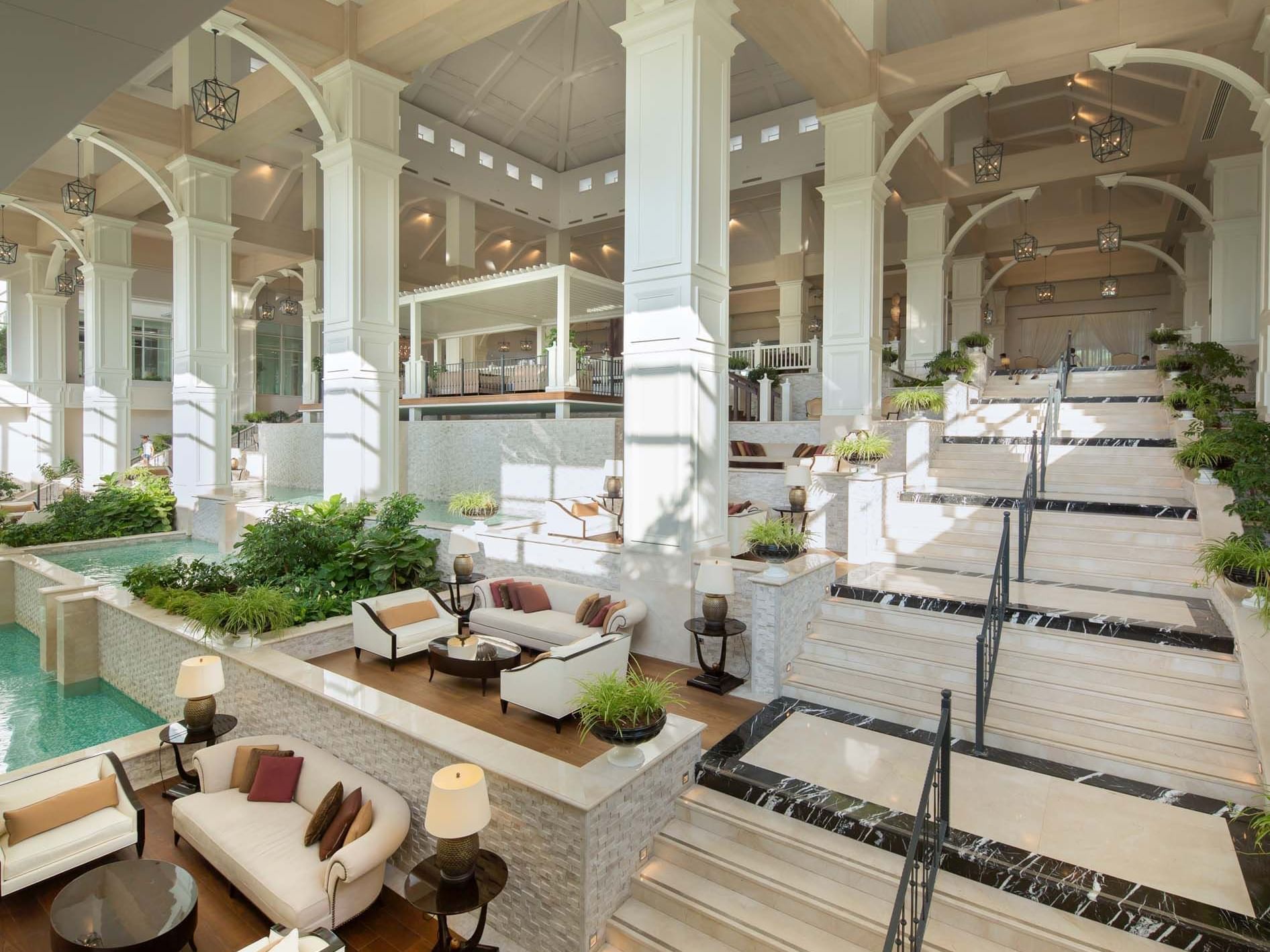 Lobby interior with arches, steps, and lounging areas at Titanic Deluxe Golf Belek