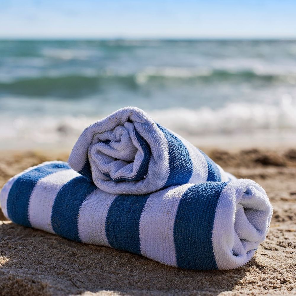 Rolled towels on beach at Lorraine Hotel