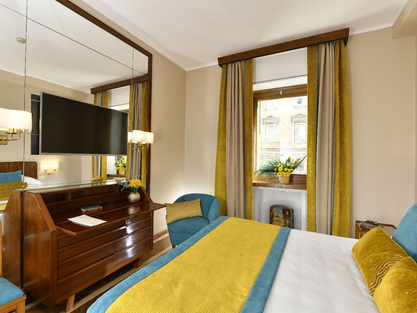 King bed, blanket, pillows & TV in Classic Deco Room at Bettoja Hotel Mediterraneo