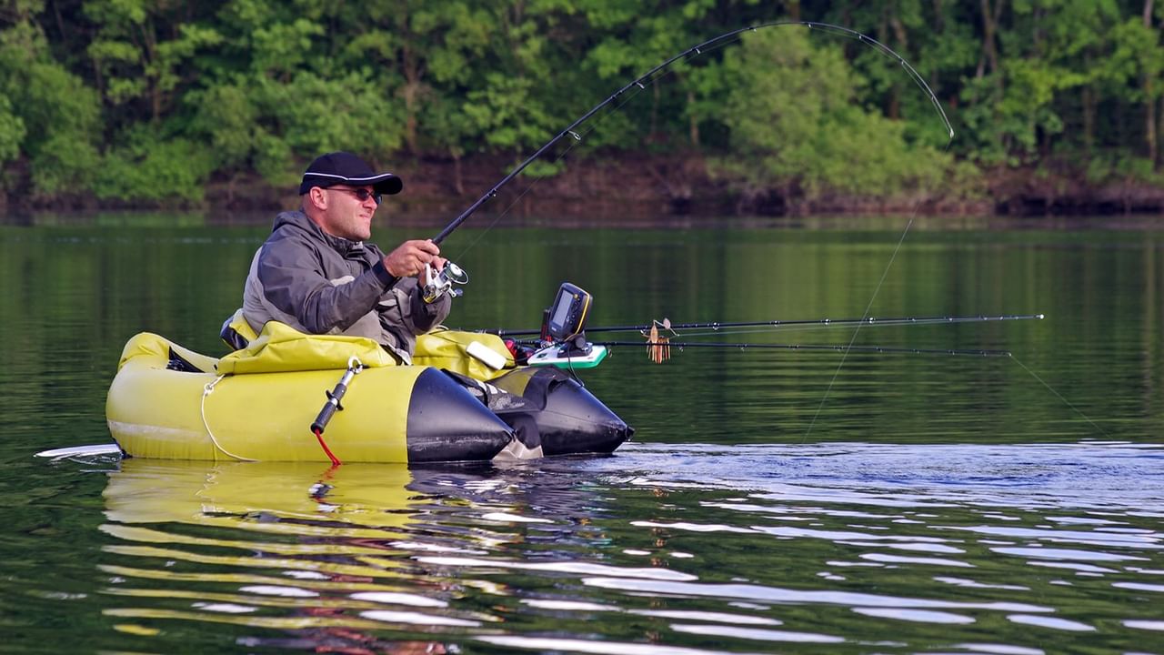 Man fishing in float tube at the lake near Coast Fort St. John