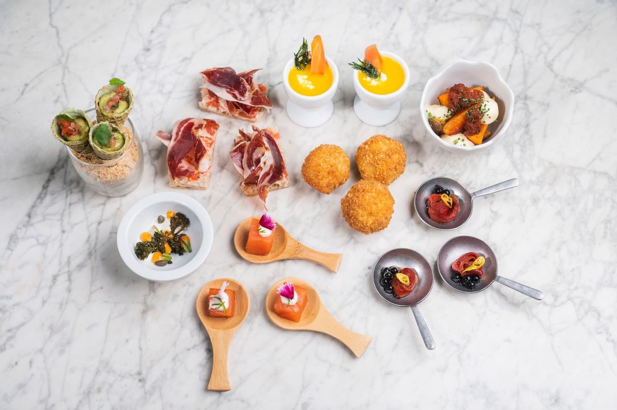 Various dishes served at Almanac Barcelona luxury hotel deals