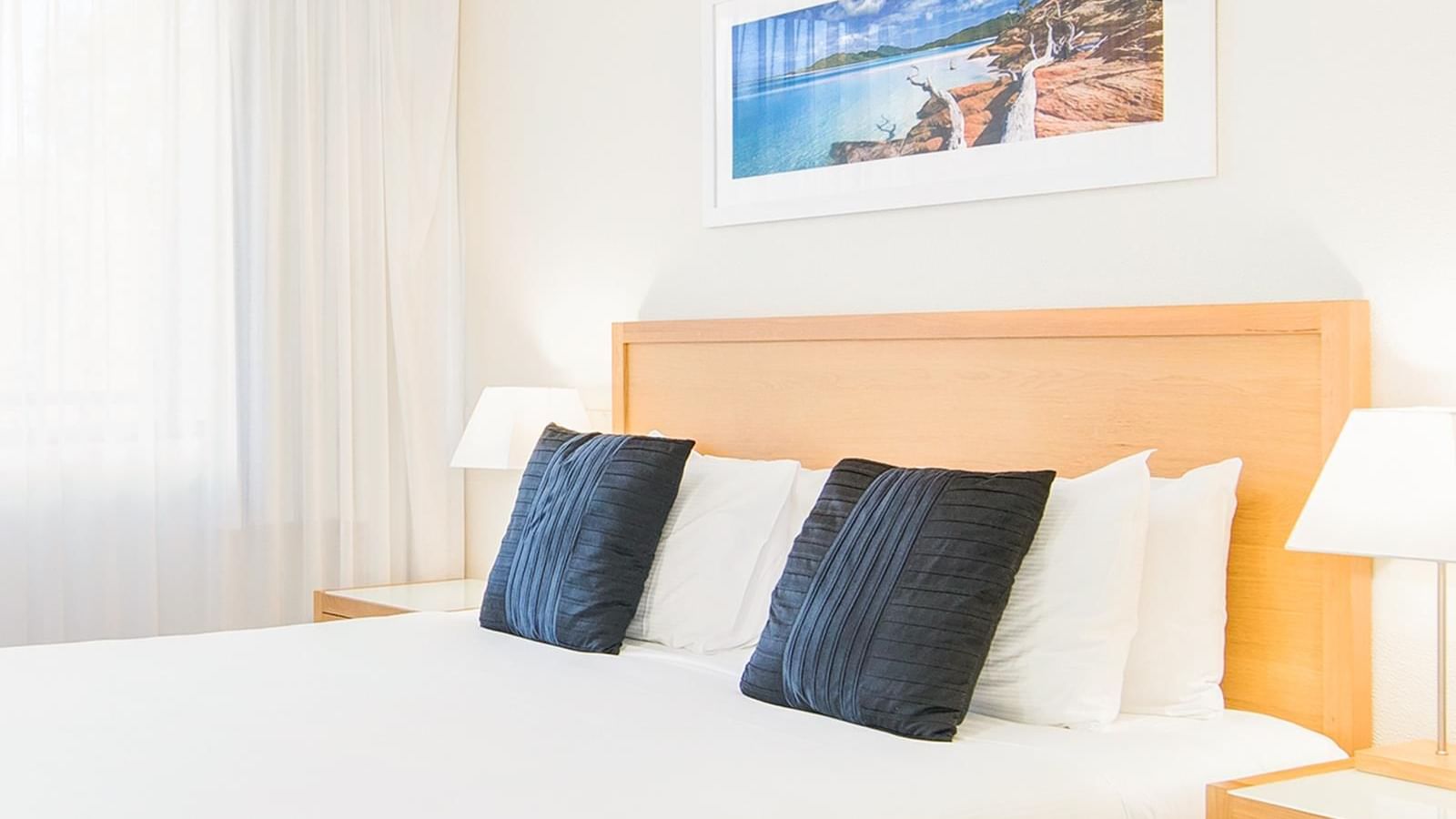 Art hung by the king bed in Executive King Room at Mercure Charlestown