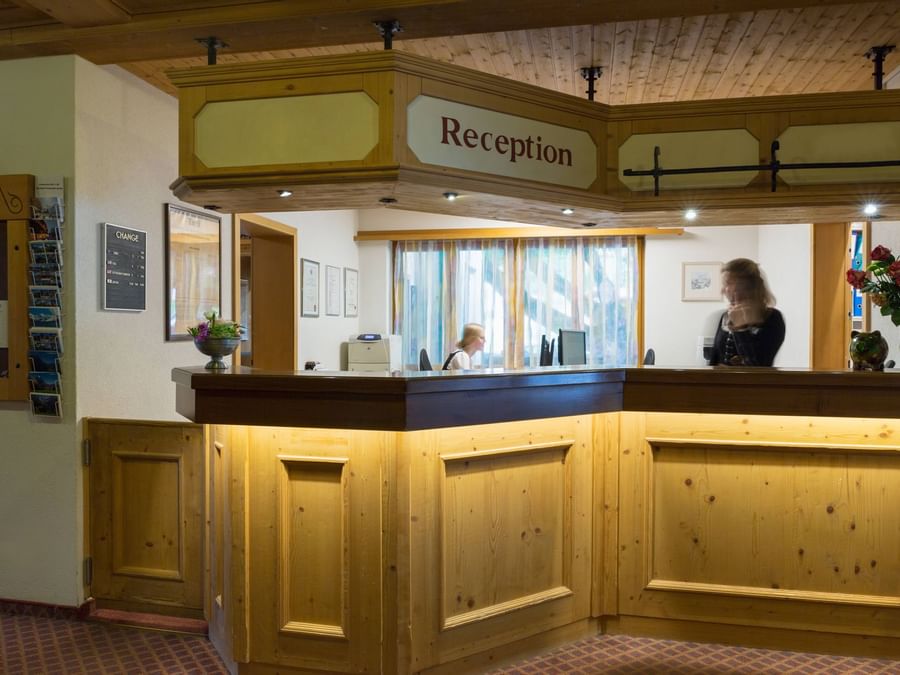 Receptionist at the reception of Hotel & Apartments Kirchbuehl