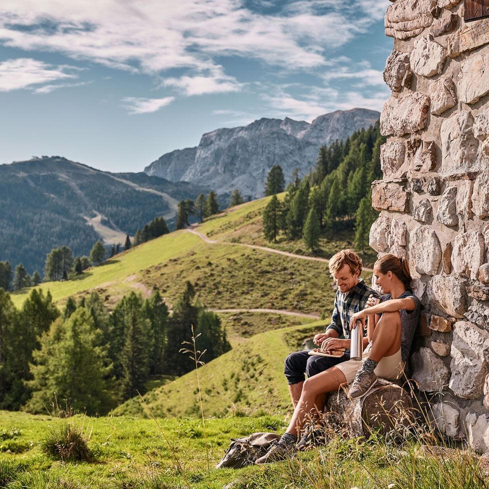 Couple by a mountain view at Falkensteiner Hotel Sonnenalpe