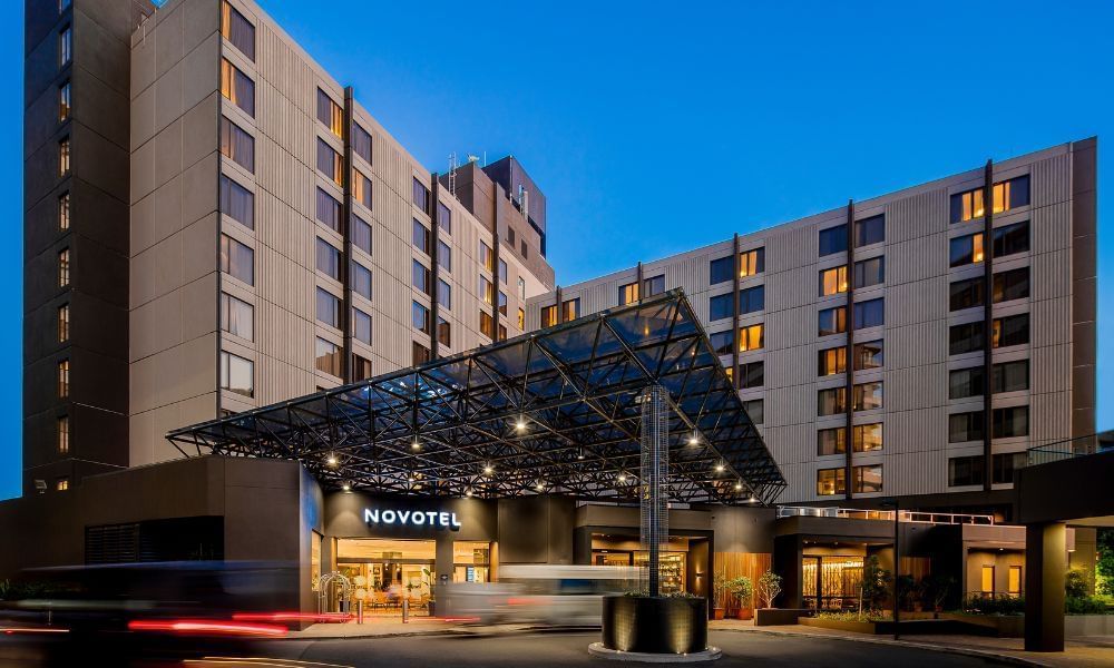 Novotel Sydney International Airport Hotel viewed from outside of the main entrance