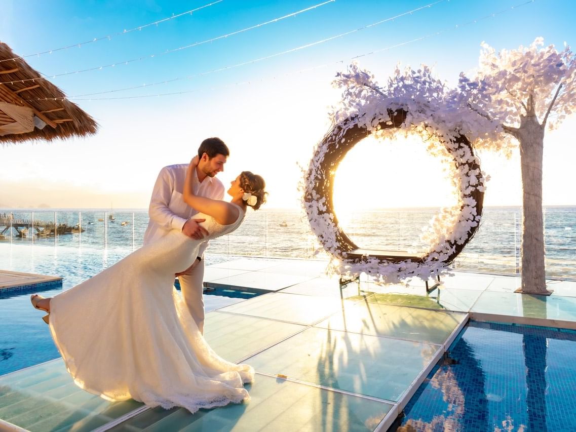 Wedding couple celebrating their wedding day at Playa Los Arcos