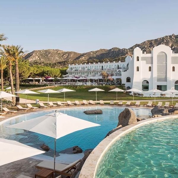 Exterior view of Resort Capo Boi & pool at Falkensteiner Hotels