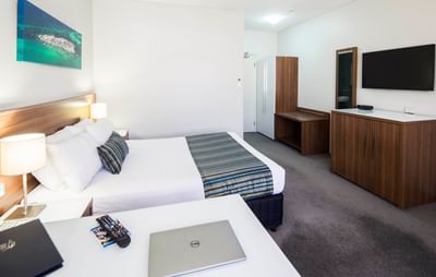 King bed & work desk in Deluxe Room at Ocean Centre Hotel