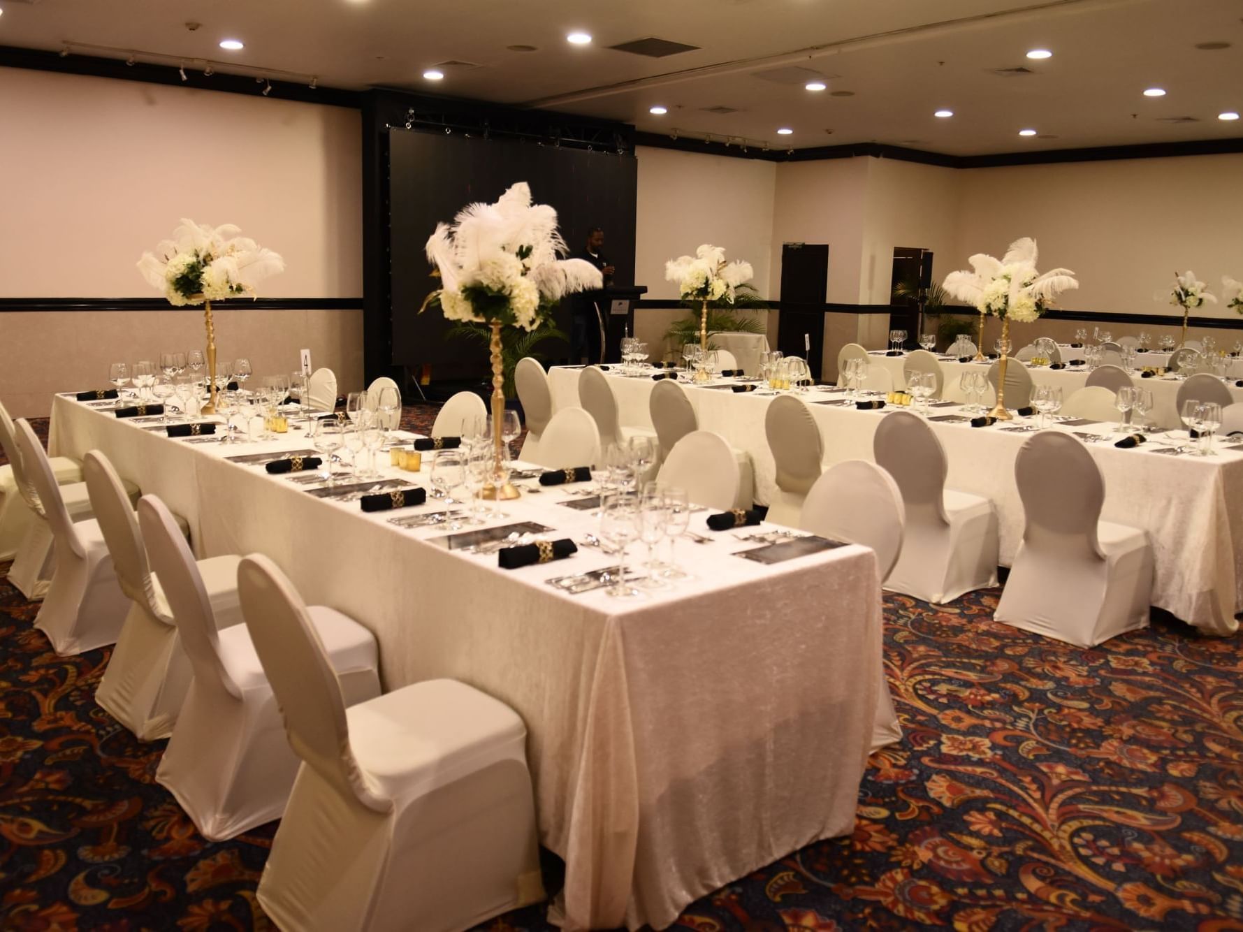 Table arrangement with flower décor in Legacy Suite at Jamaica Pegasus Hotel