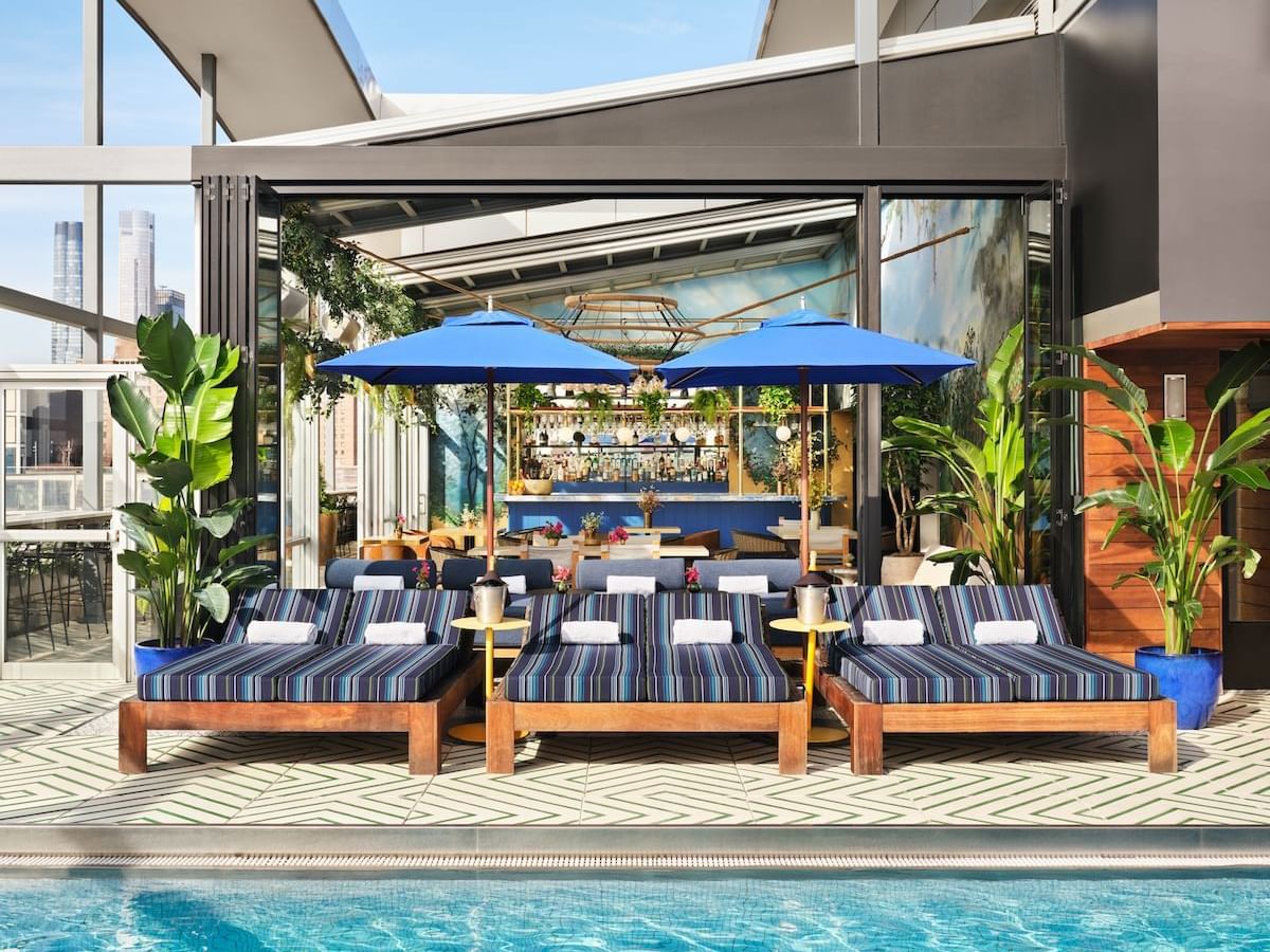 Gansevoort Rooftop Pool with daybeds and poolside service