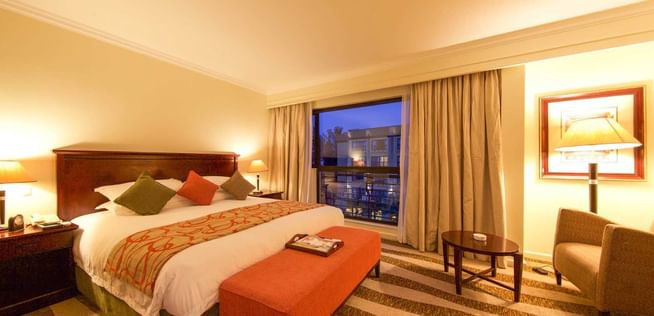 Interior of Deluxe Room with king bed at Kigali Serena Hotel