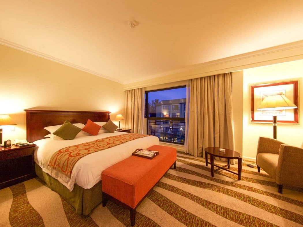 Interior of Deluxe Room with king bed at Kigali Serena Hotel