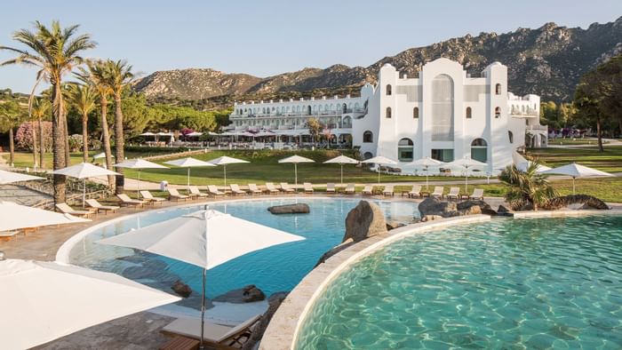 Pool with hotel background at Falkensteiner Hotel Capo Boi