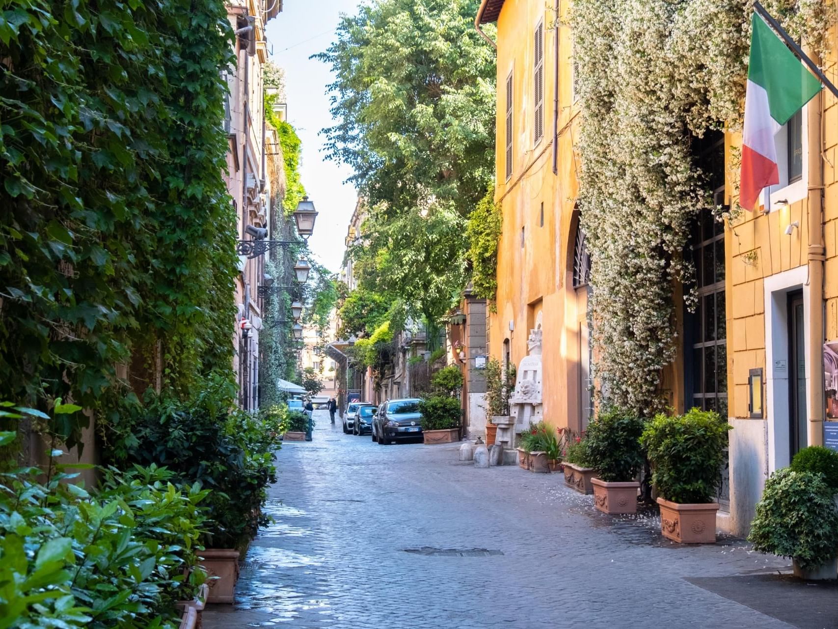 Exterior view of ivy-covered Margutta 54 with the cobblestone street