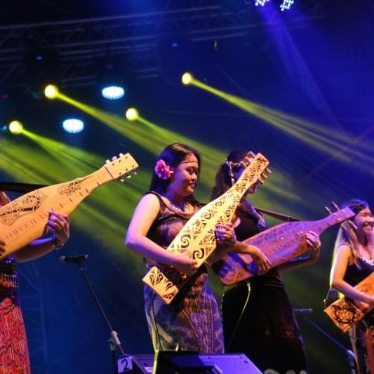 Ladies playing Sape in Rainforest World Music Festival at Hemisphere Corporation