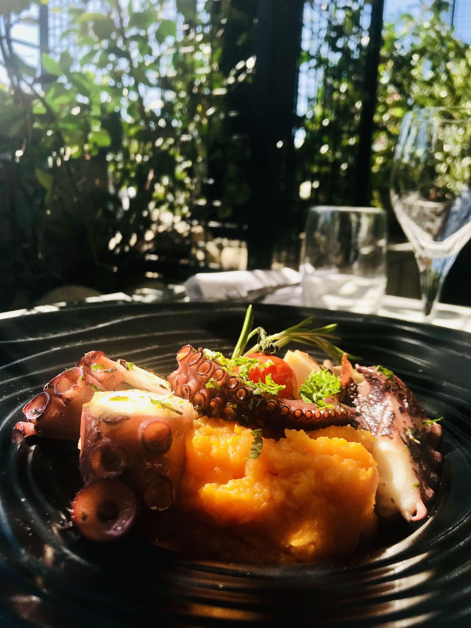 Close-up of an octopus dish served in Brasserie d'Aurillac at The Originals Boutique, Grand Hôtel Saint-Pierre