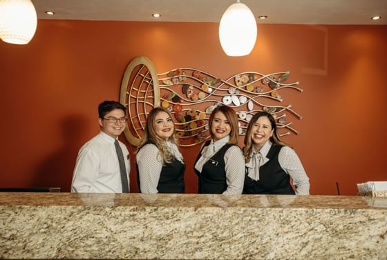 4 receptionists posing behind the desk, Araiza Hotel Hermosillo