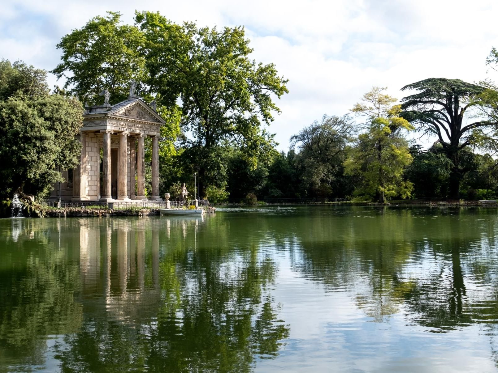 Greenery view of the Temple of Aesculapius with a lake near Margutta 54
