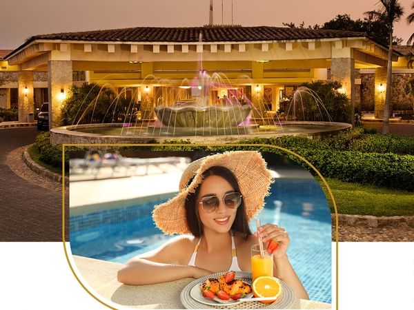 Girl enjoying in pool with hotel exterior at Mundo Imperial