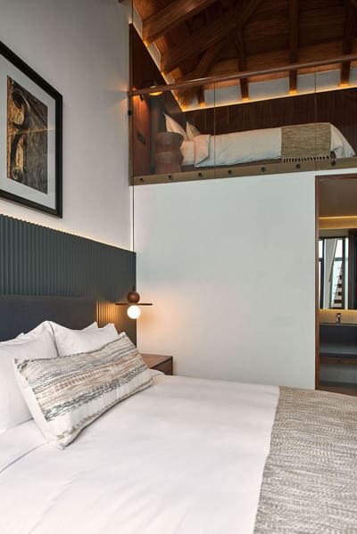 Casa Campanas bedroom with a bed, a wooden ceiling, and a loft space with a second bed at Singular Signature Residences