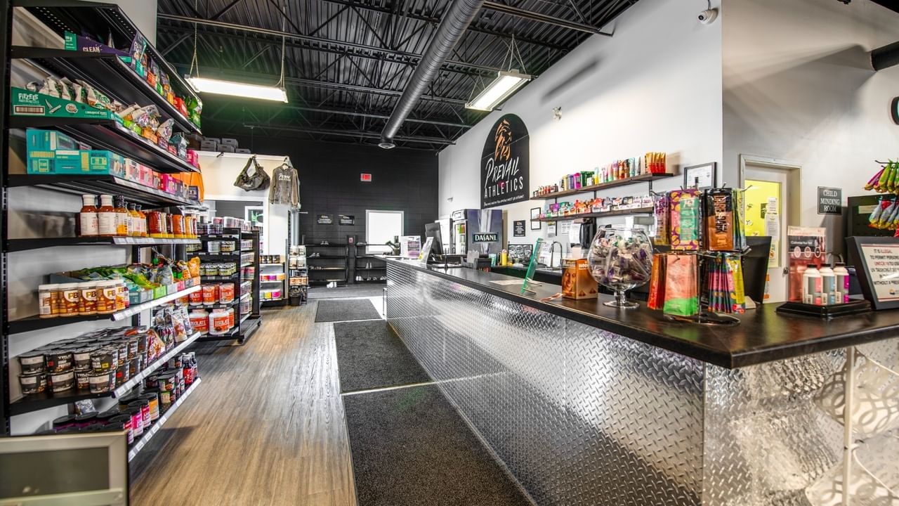 Gym with shelves of products.