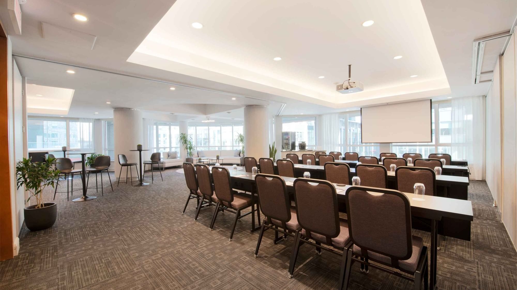 Classroom set-up with a projector screen in Salon De La Montagne at Warwick Le Crystal – Montreal