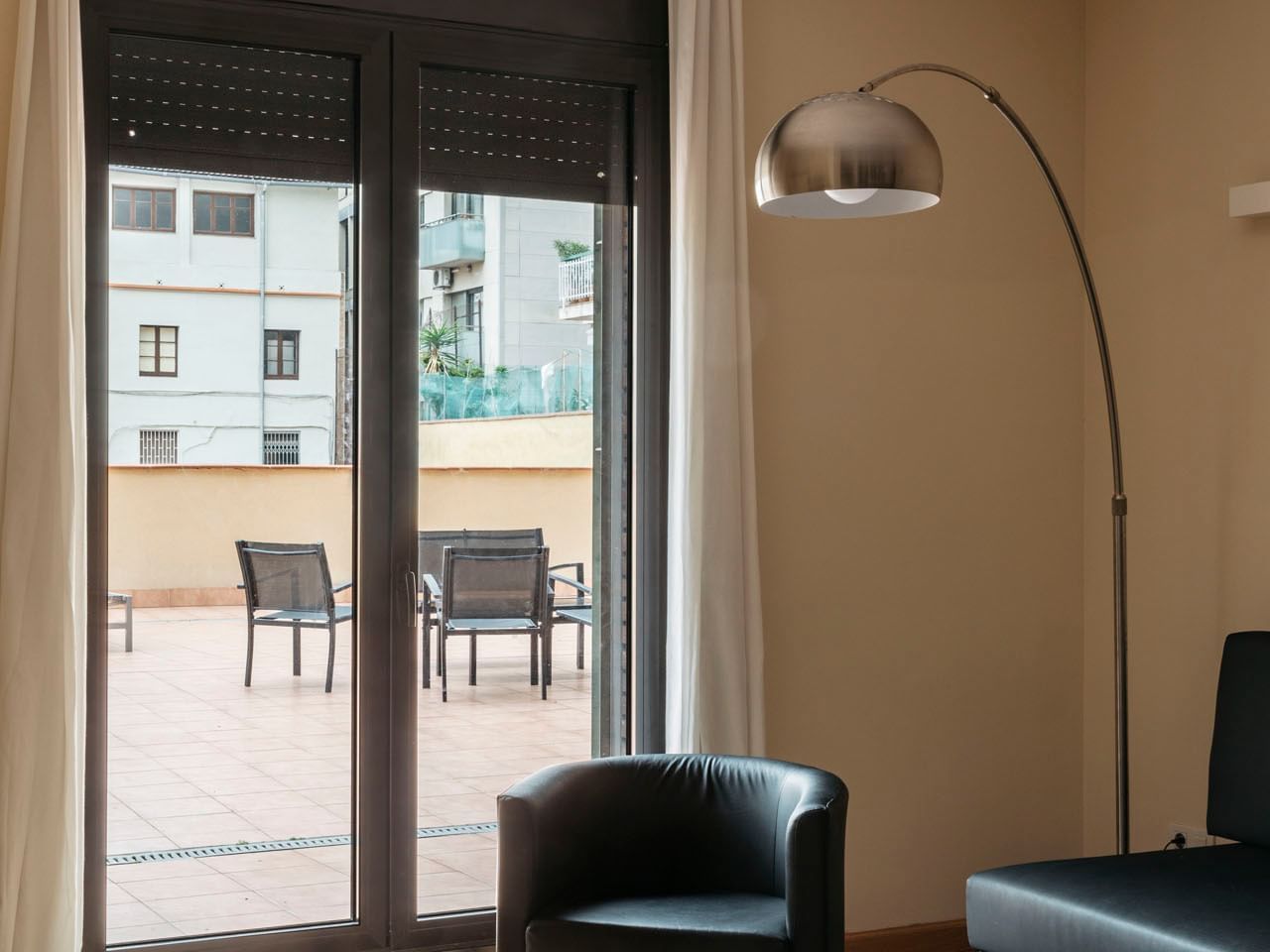 Outdoor lounge area in Terrace Deluxe at Barcelona Apartments