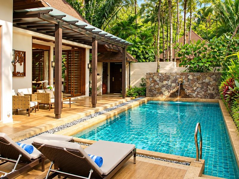 Grand Garden pool villa with sun loungers, covered terrace, and lush tropical garden for Malaysian Residents' Wellness Escape