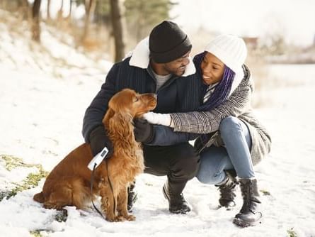 couple with their dog