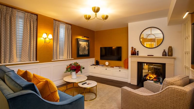 Lit and luxurious Hyde Park Suite at Warwick Hotels and Resorts, with a fireplace and stylish decor