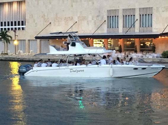 Dulzura sport boat taking a guest ride on the sea near Hotel Isla Del Encanto