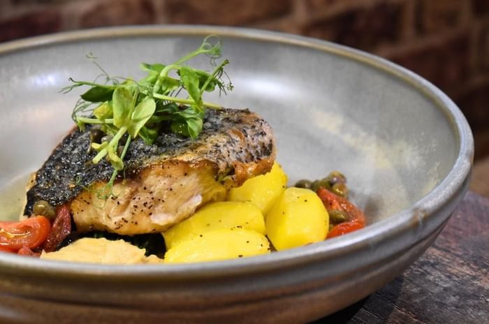 Fish dish featuring Restaurant Club savings at Villiers Hotel in Buckingham
