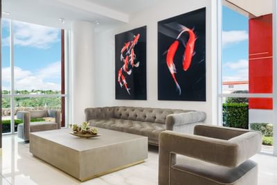 Comfy sofas & fish paintings in the lobby at Costa Beach Resort