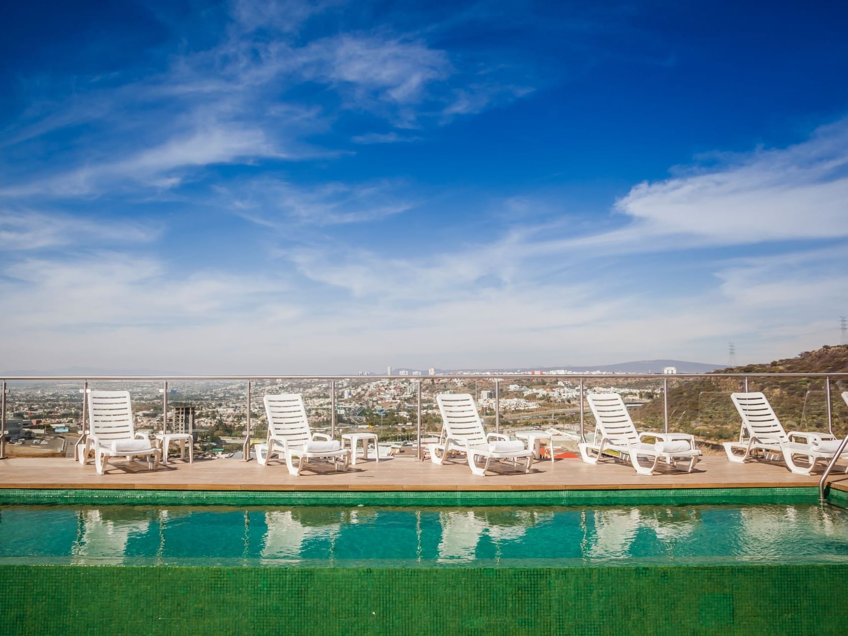Rooftop swimming pool with pool beds at Fiesta Inn Hotels