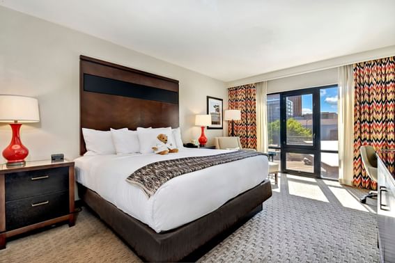 King bed & furniture in a room at Hotel 43
