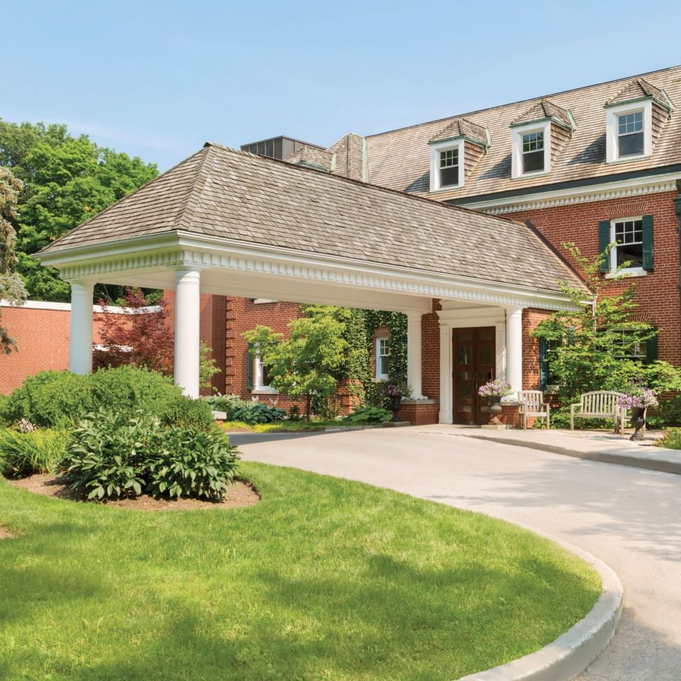 Main entrance with a wood-shingled porte-cochère at Spencer Hotel & Conference Centre, best hotels in London Ontario
