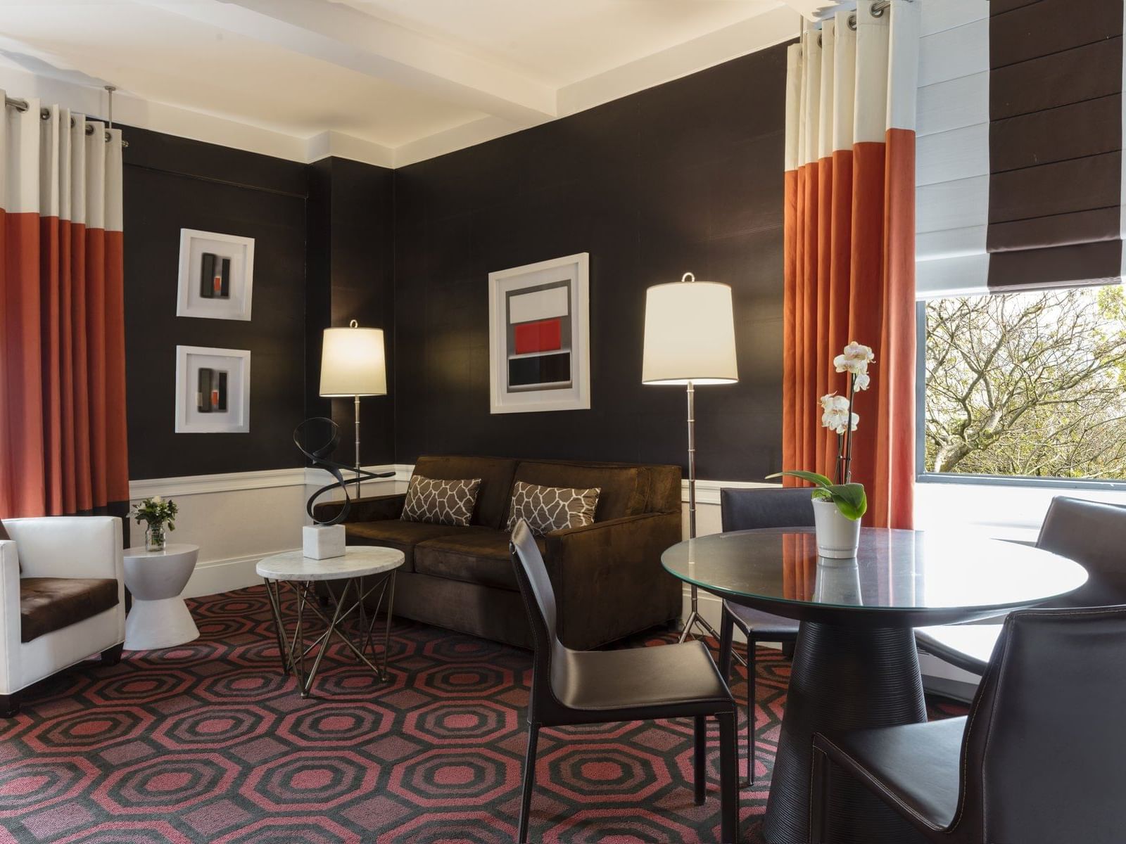 Modern furniture inside a corner suite at the Empire Hotel