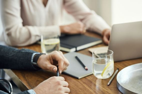 Two people in a business meeting at Defoor Hospitality