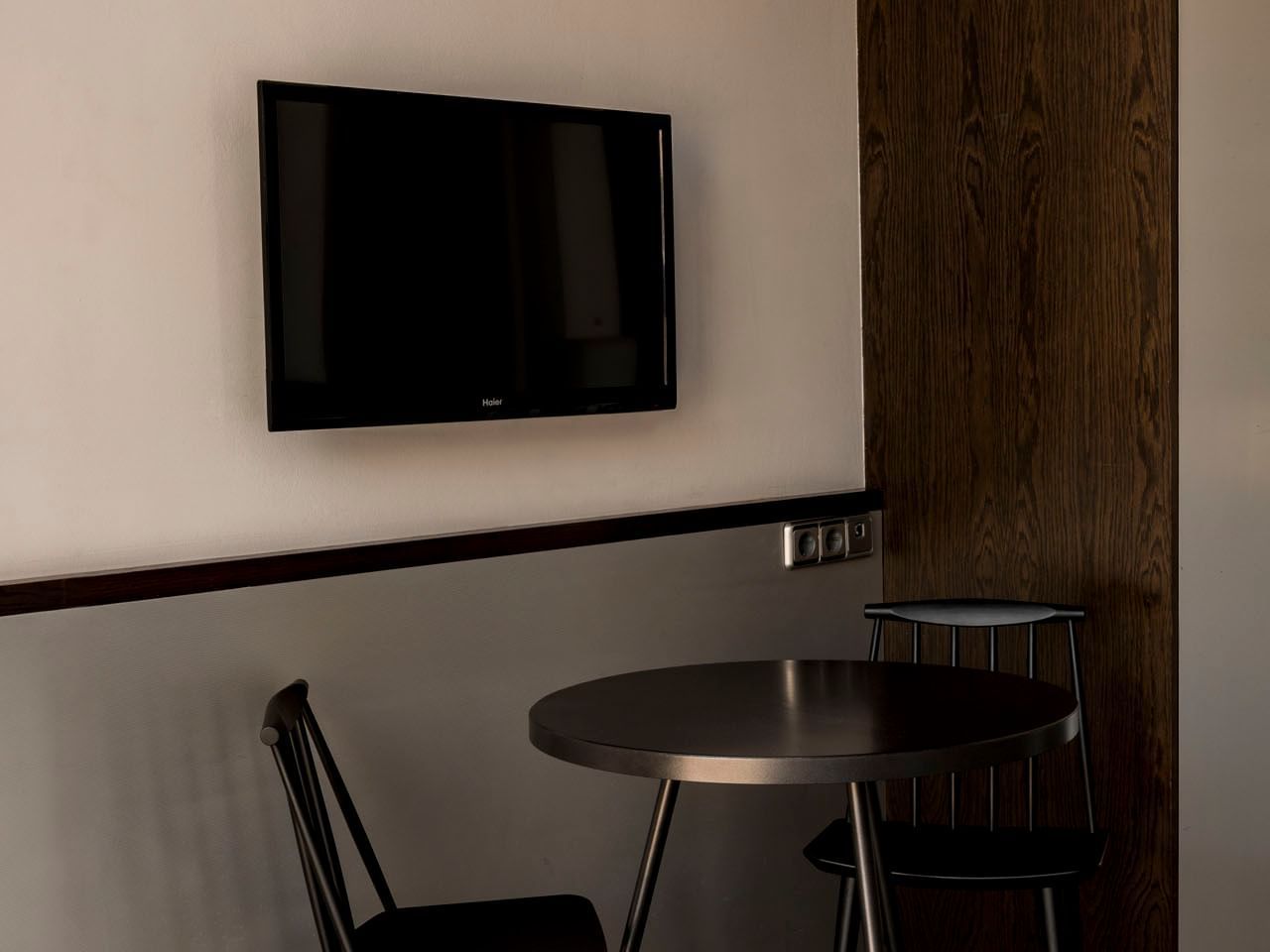 A TV by a dining table in Standard at Aparthotel Allada