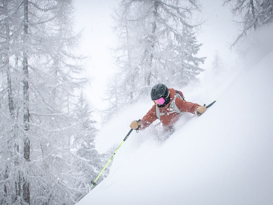 Person Backcountry Skiing in the mountains near Hotel Jackson