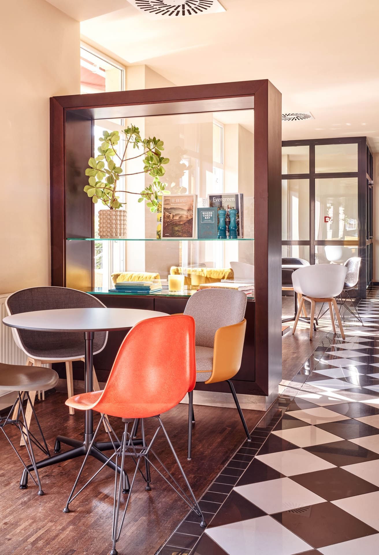 4 chairs around a high table in a restaurant at Flemings Hotels